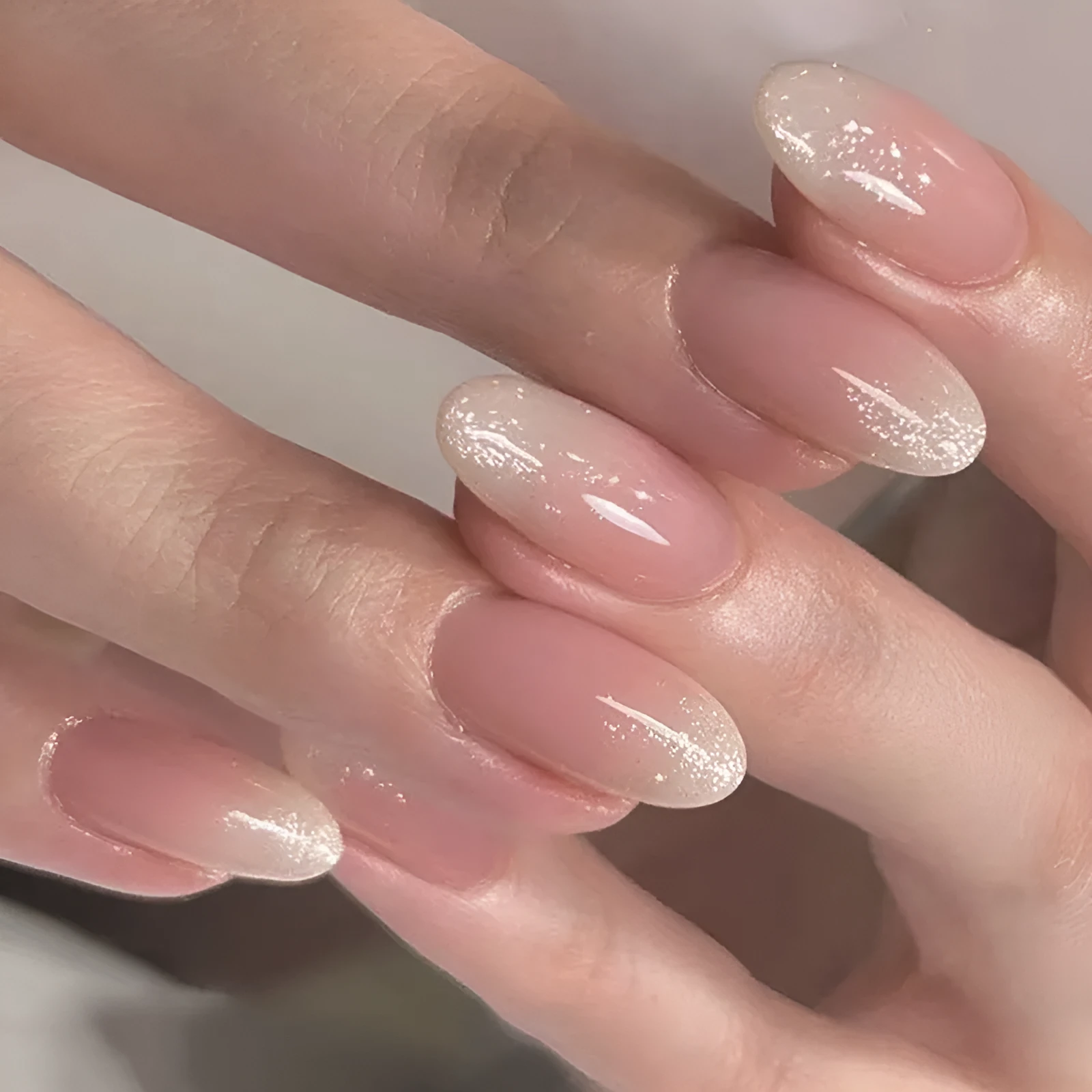 Short oval glitter French wear finished nail plates in colour JP2324 with glue included