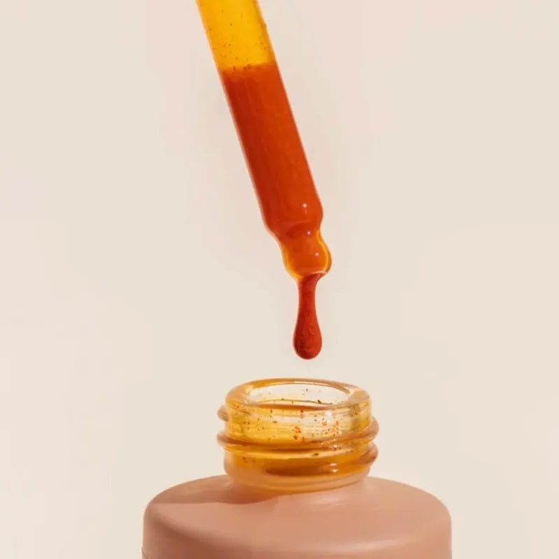 60ml bottle of sun tanning drops for enhancing natural skin colour without sun exposure