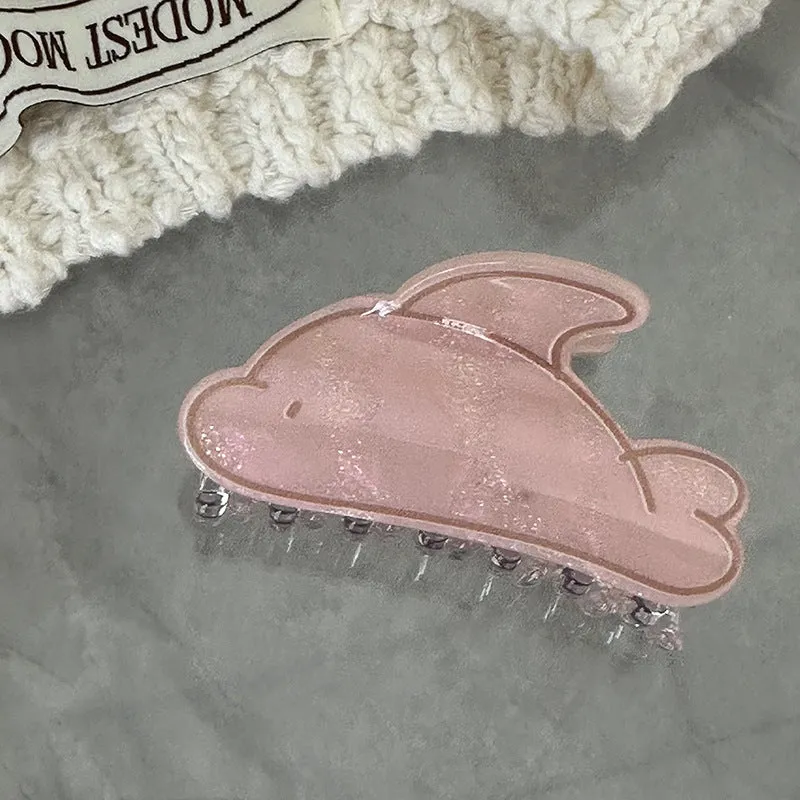 Women's dolphin grabber clip headdress in acetate material, available in blue and pink sizes, styled on hair