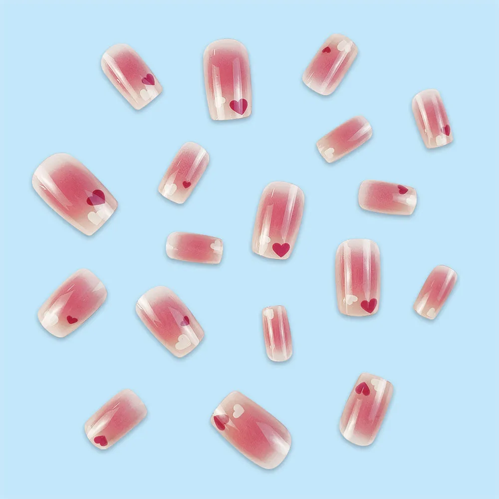 Red and white love gradient nail stickers with starry sky pattern and glue tube