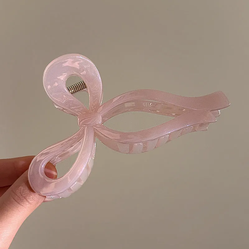 Women's ice bowknot resin hair clip with sweet bow design in blue, pink, and white colour options