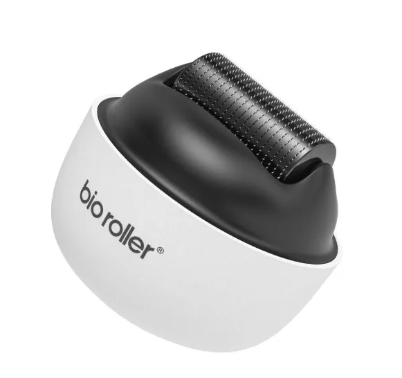 Men's G4 white portable beard derma roller with six microneedle length options on a clean surface