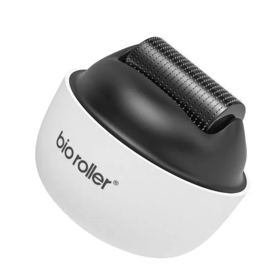 Men's G4 white portable beard derma roller with six microneedle length options on a clean surface
