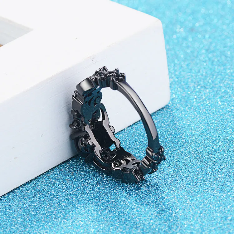 Unisex copper punk electroplated black gold ring with inlaid black zircon stone and olive branch motif on black background