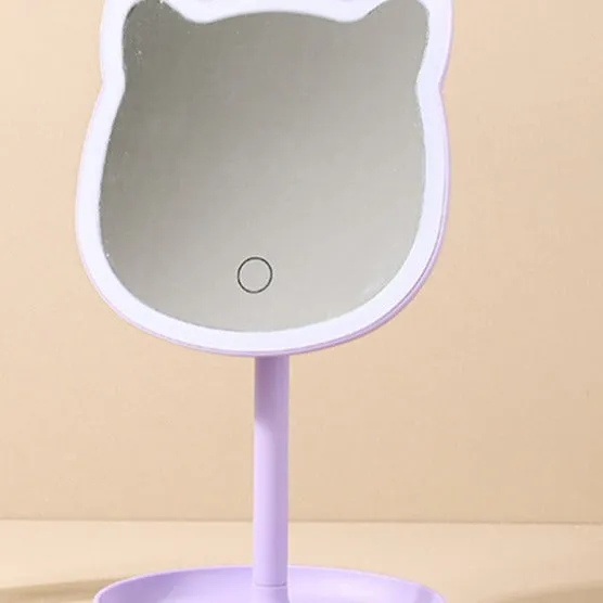 Pink rechargeable makeup mirror with fill light on a desk, ABS frame, aluminium mirror, size 14cm x 18cm