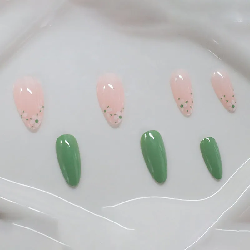 Long almond artificial nails with white little flower pattern and jelly glue rub in CW680 colour classification