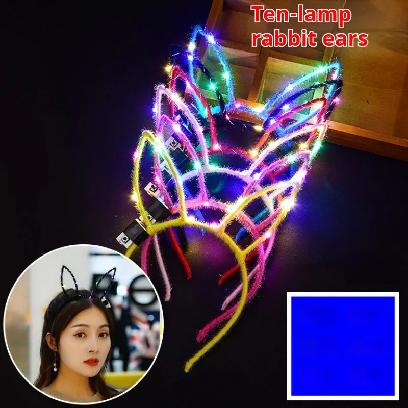 Glowing headdress antlers headband with LED lights on pink background, plastic construction with cat ears style