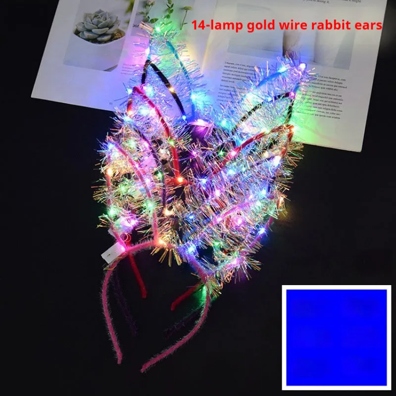 Glowing headdress antlers headband with LED lights on pink background, plastic construction with cat ears style