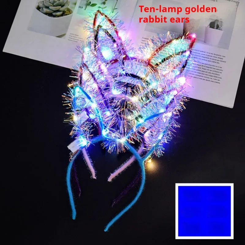 Glowing headdress antlers headband with LED lights on pink background, plastic construction with cat ears style
