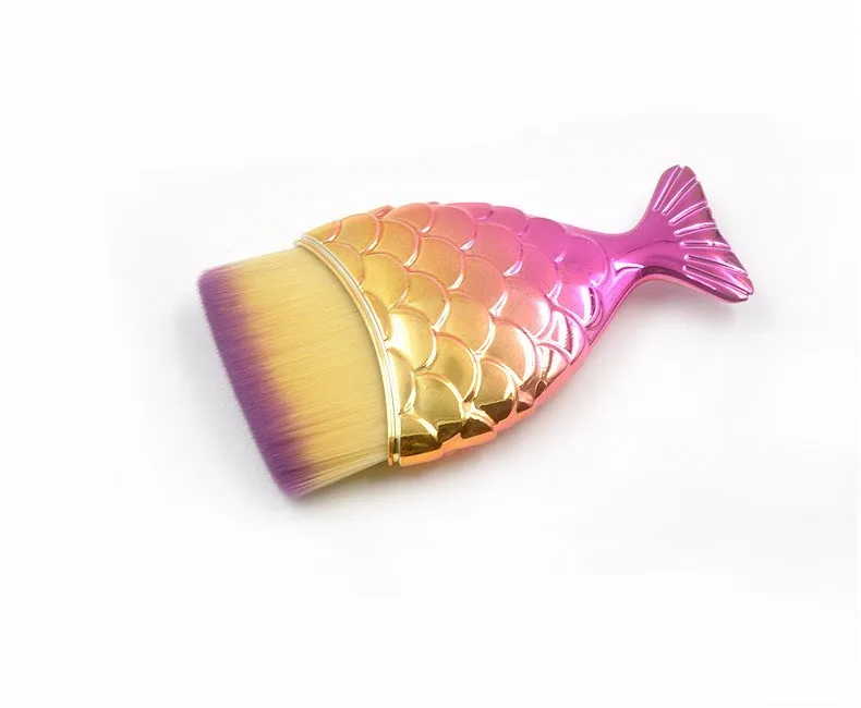 Blue fishtail makeup brush with artificial fibre bristles and short plastic handle on white background