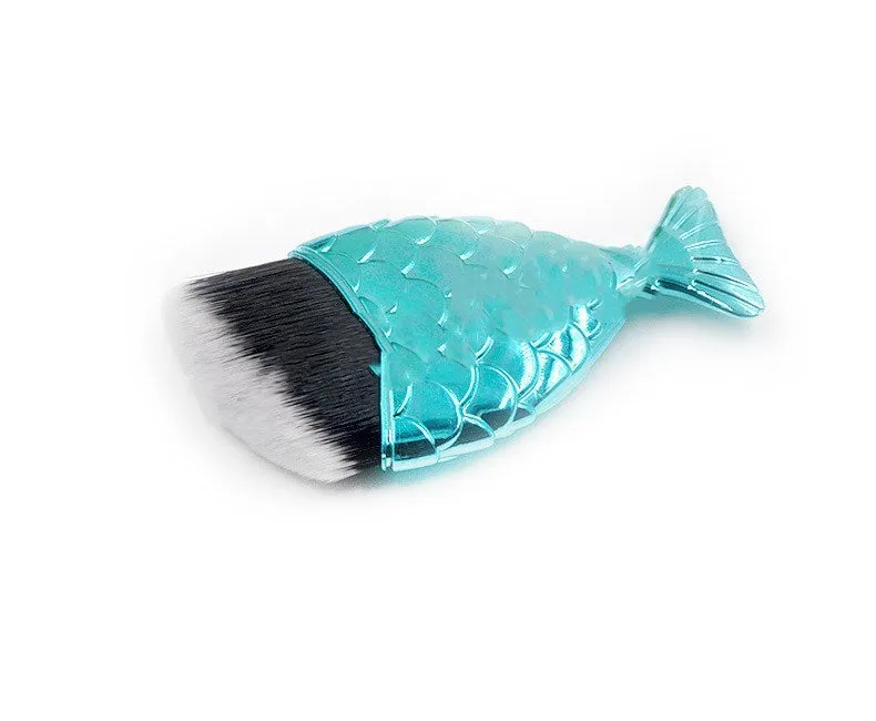 Blue fishtail makeup brush with artificial fibre bristles and short plastic handle on white background