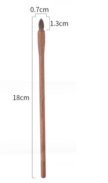 Set of 5 walnut eye makeup brushes with wool bristles on a flat surface.