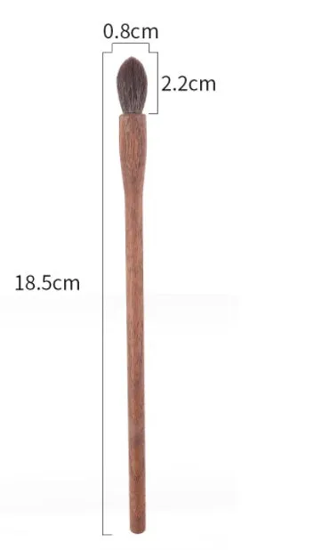 Set of 5 walnut eye makeup brushes with wool bristles on a flat surface.
