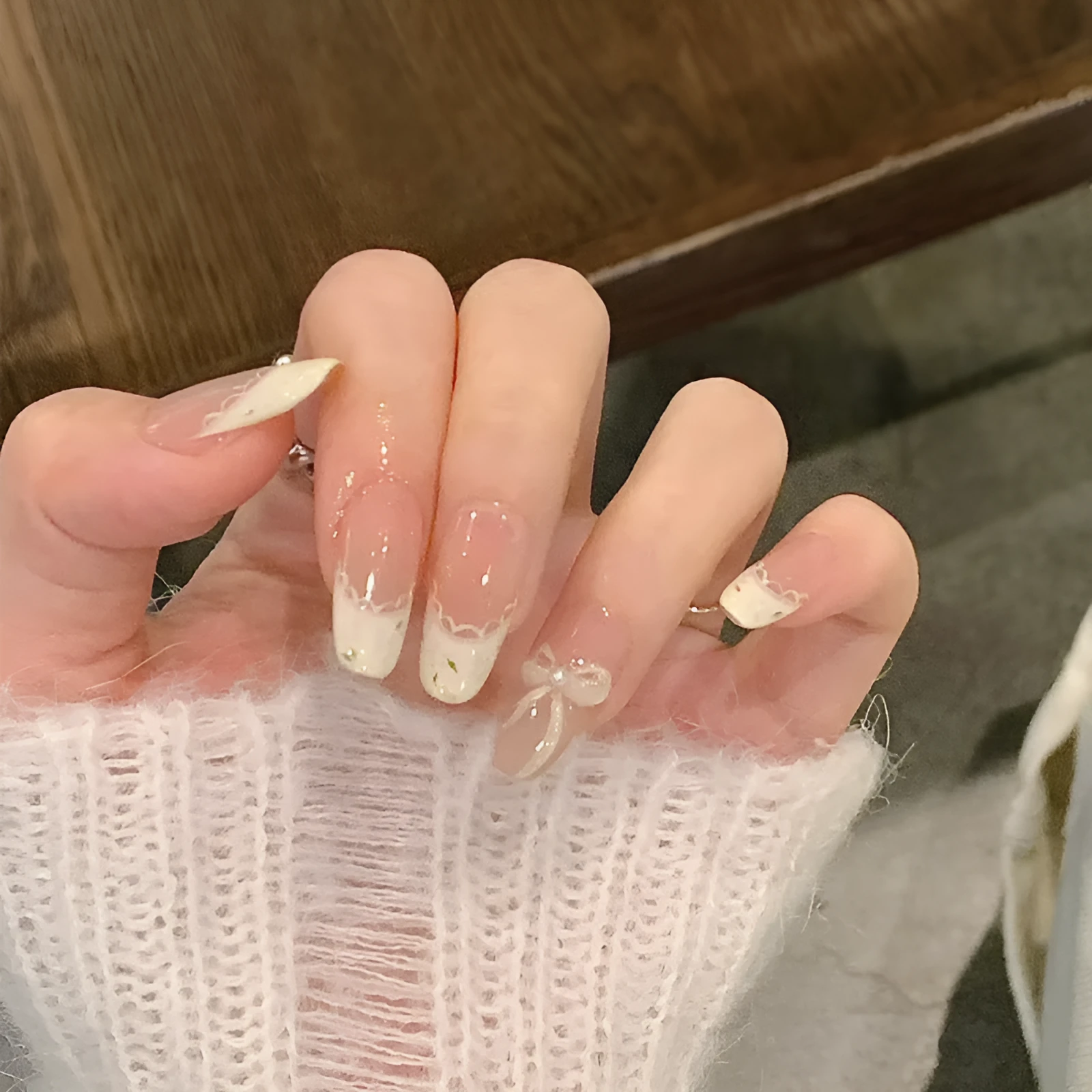 Pink artificial false nails with sweet girl illustrations, sold in sets of 5, 10, or 15.