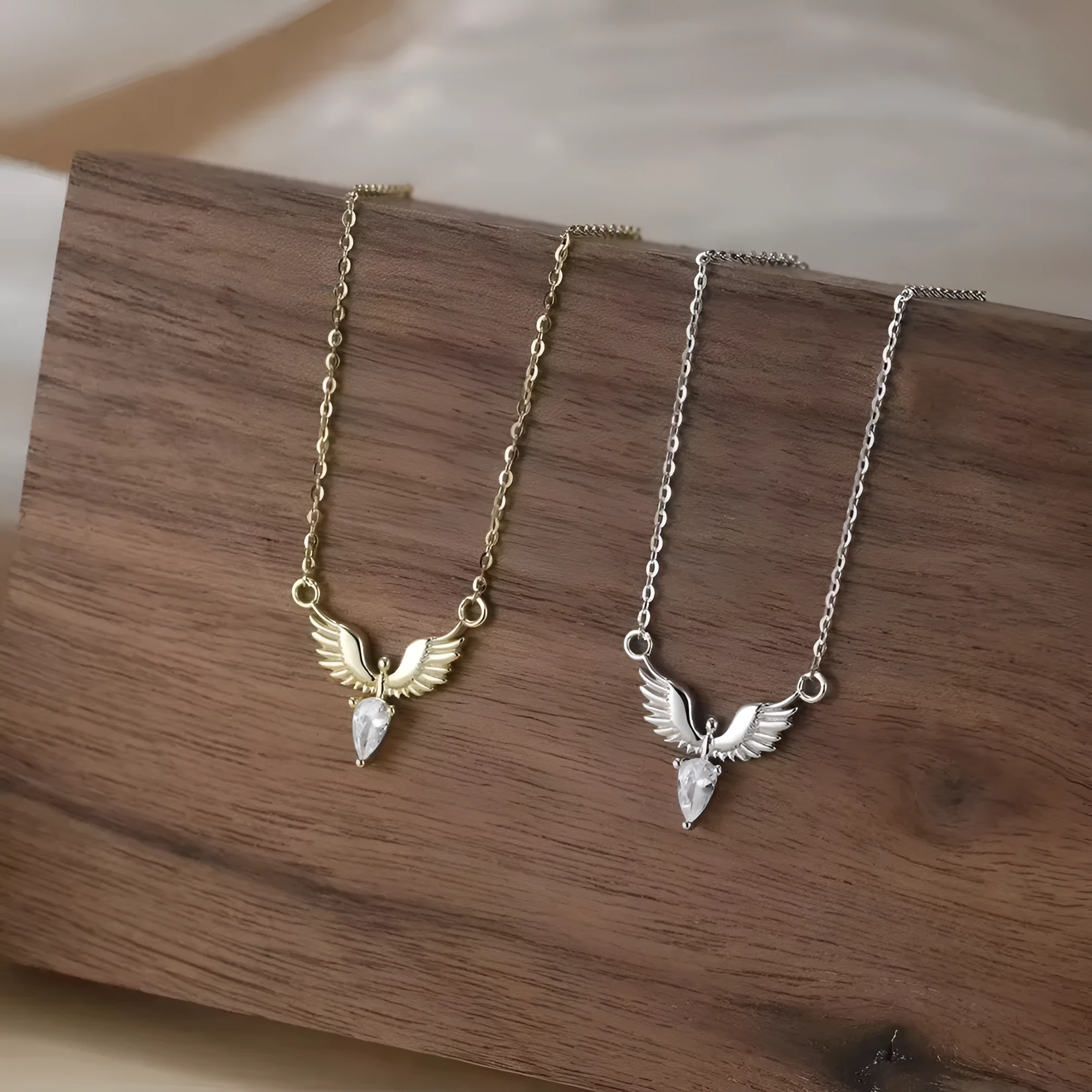 Women's silver eagle pendant necklace on an adjustable O-ring chain with white gold or yellow gold electroplating.