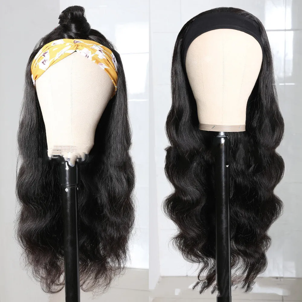 Long curly black synthetic wig with big wave and centred bangs on a head model