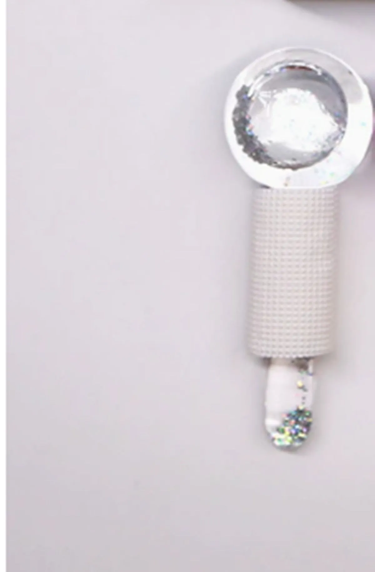 Set of two beauty ice wave ball face massage tools in purple flash finish on white background