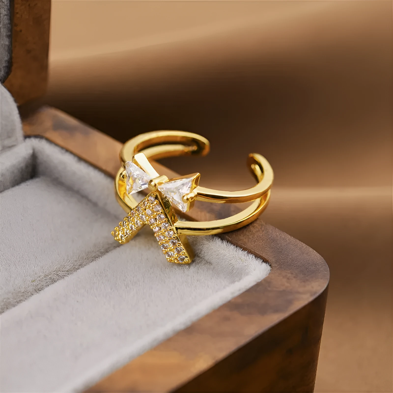 Gold geometric open adjustable ring for women on a white background.