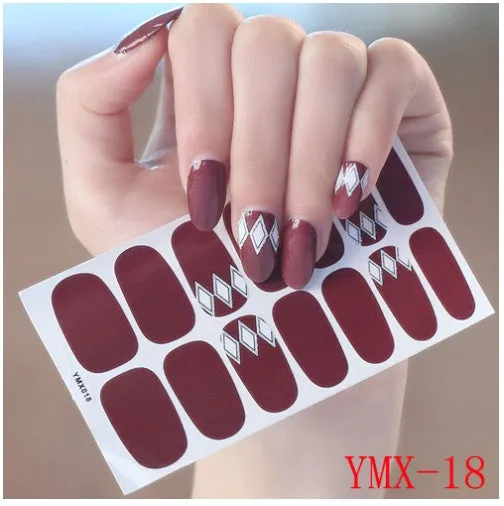 Full nail stickers set of 14 sheets showing 16 colour options in a flat lay arrangement