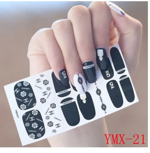 Full nail stickers set of 14 sheets showing 16 colour options in a flat lay arrangement