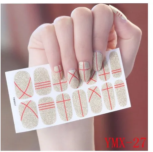 Full nail stickers set of 14 sheets showing 16 colour options in a flat lay arrangement