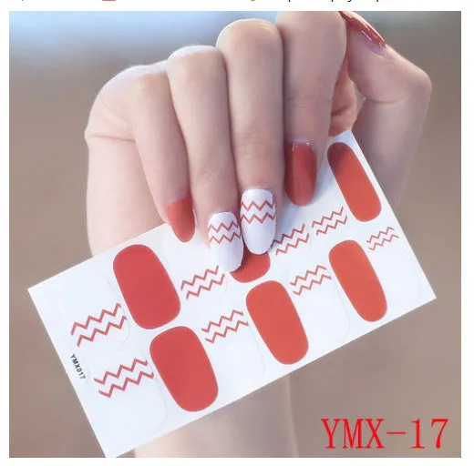 Full nail stickers set of 14 sheets showing 16 colour options in a flat lay arrangement
