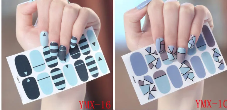Full nail stickers set of 14 sheets showing 16 colour options in a flat lay arrangement