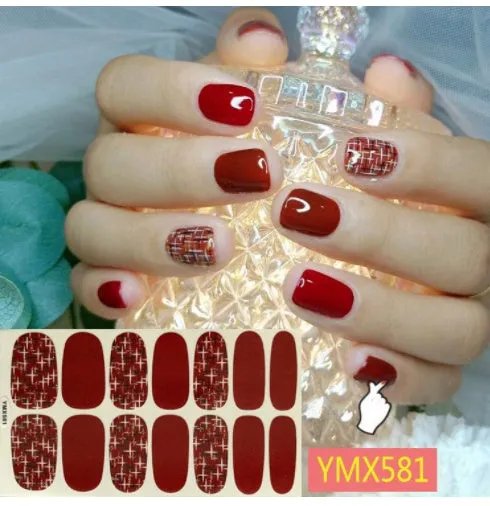 Full nail stickers set of 14 sheets showing 16 colour options in a flat lay arrangement