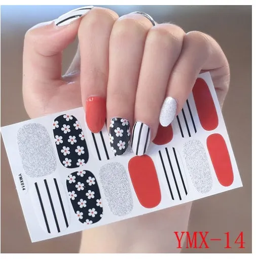 Full nail stickers set of 14 sheets showing 16 colour options in a flat lay arrangement