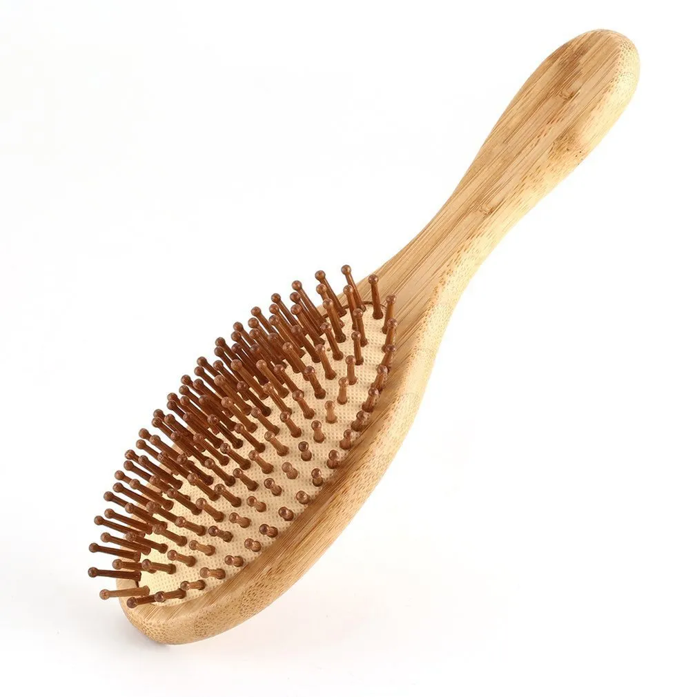 Carbonized bamboo massage comb 66x218mm on a neutral background, showing natural wood texture and teeth