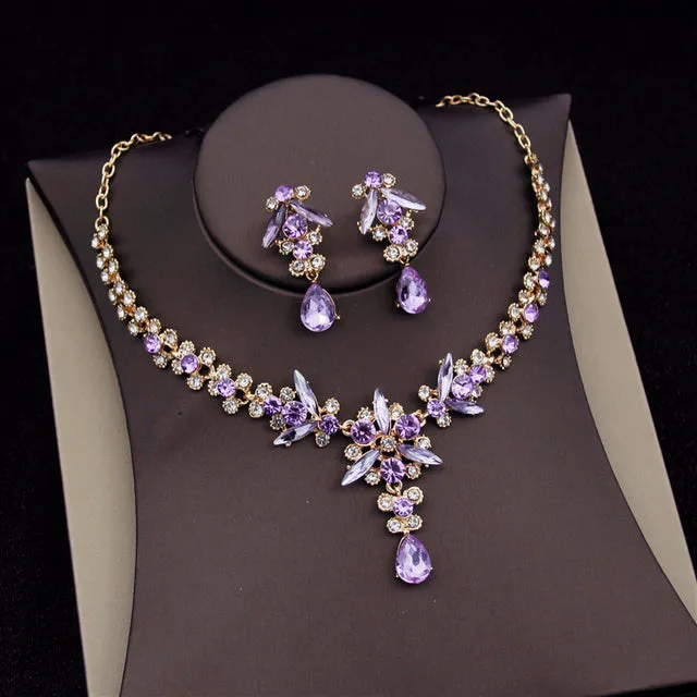 Royal Queen bridal crown necklace earring set made from zinc alloy and rhinestones in pink colour with green sandalwood