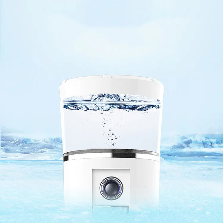 White rechargeable USB portable facial moisturiser spray 15cm by 4.5cm on a table