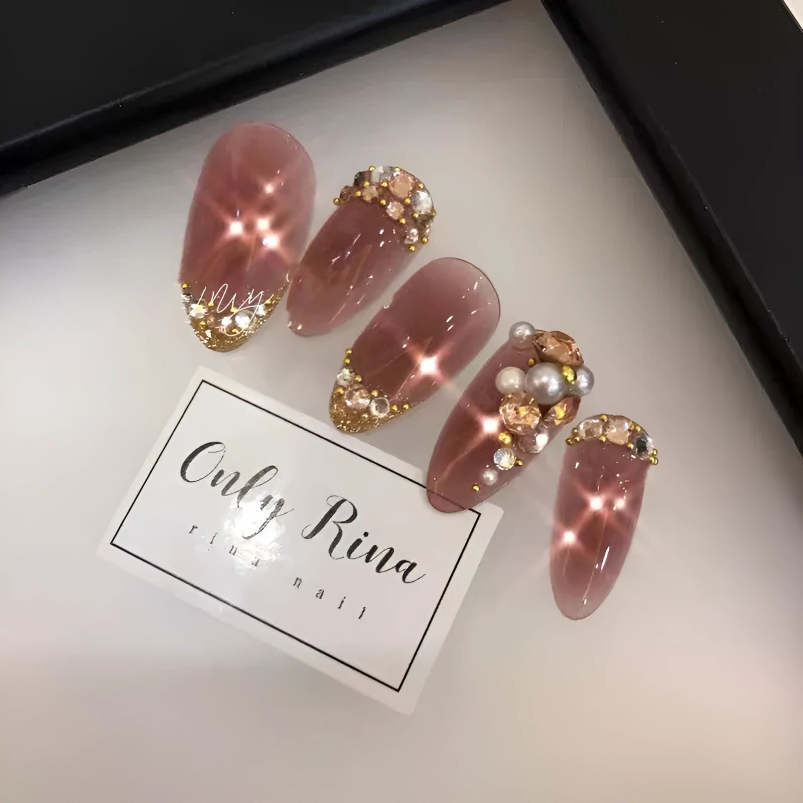 Handmade manicure finished fake nails in light brown colour for bride wear