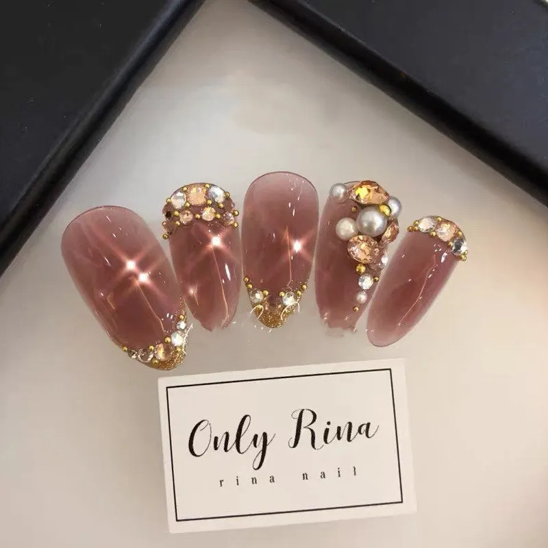 Handmade manicure finished fake nails in light brown colour for bride wear