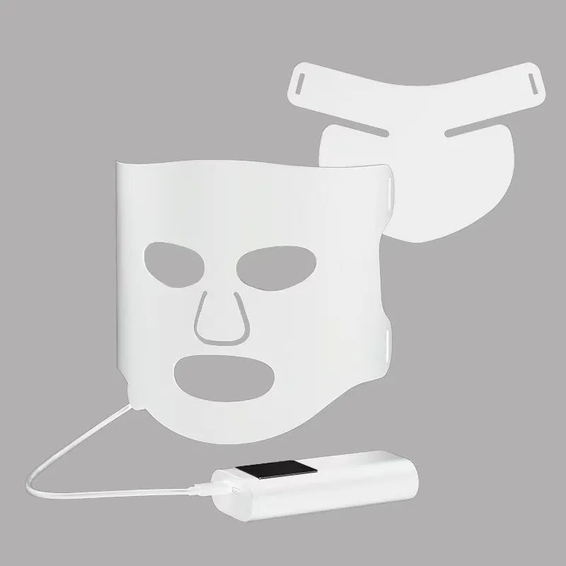 Black and gold LED phototherapy face mask with controller on a white background.