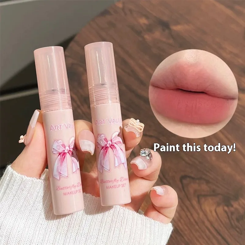 Butterfly Box pink makeup set with four matte lip muds, powder blusher, and necklace