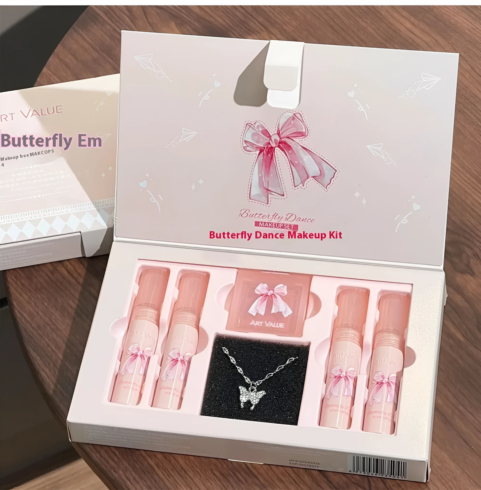Butterfly Box pink makeup set with four matte lip muds, powder blusher, and necklace