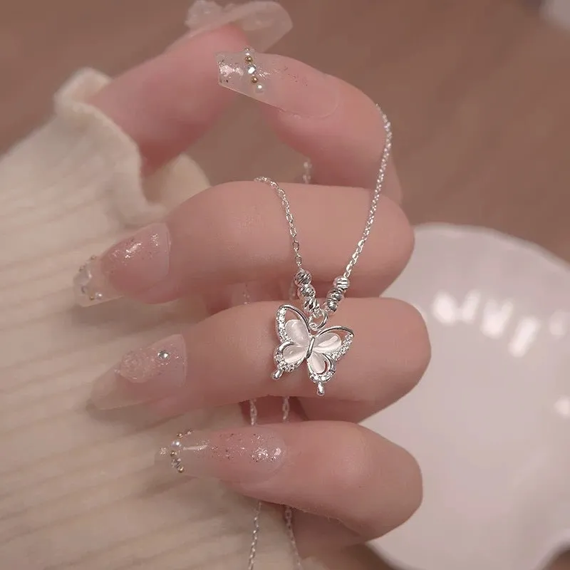 Women's square line opal butterfly pendant necklace on a silver adjustable cross chain.