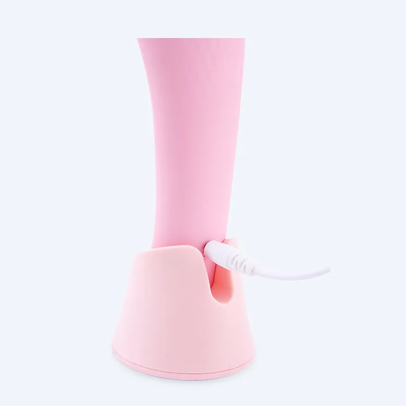 Pink electric silicone face cleansing brush with vibration and heating functions, USB rechargeable