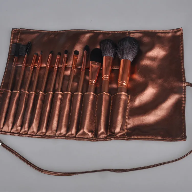 Multi-function makeup brush set with synthetic fibre bristles, long plastic handles, and brown PU storage bag on a flat surface