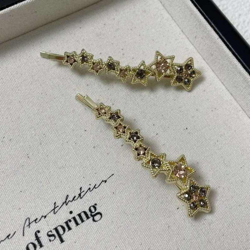 Gold-coloured alloy hair barrette with rhinestone, star, and word decoration in Korean style.
