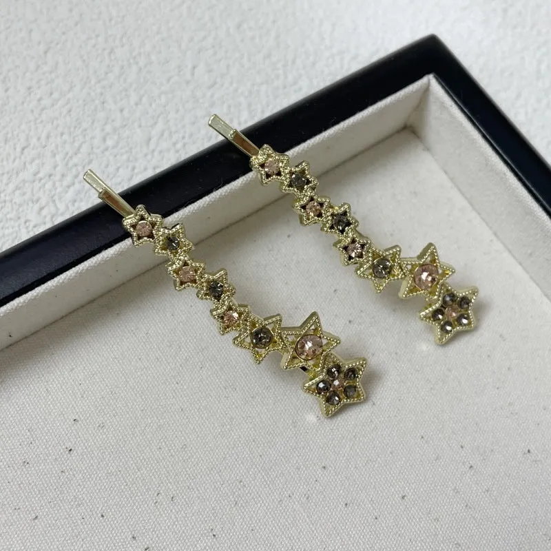Gold-coloured alloy hair barrette with rhinestone, star, and word decoration in Korean style.