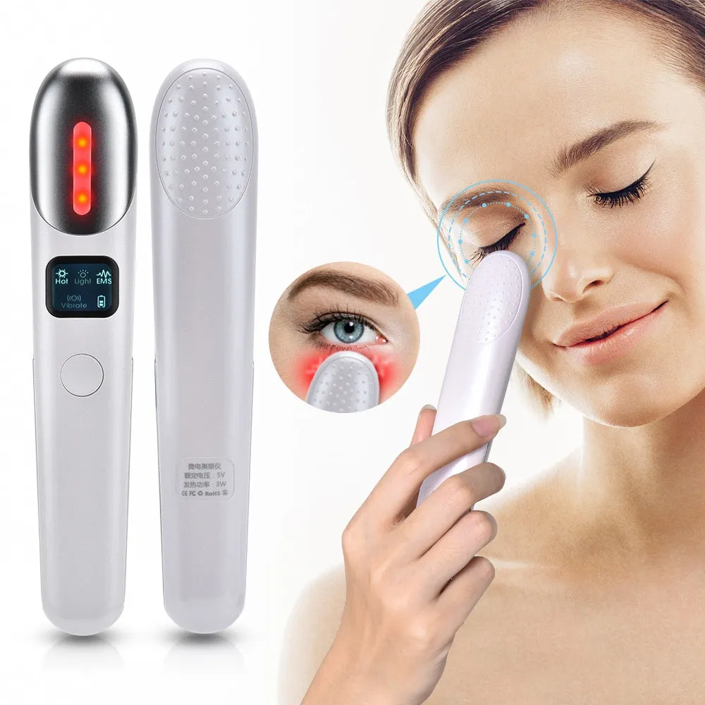 Pink EMS eye massager with micro electric current and heating for eye care, resting on a white surface
