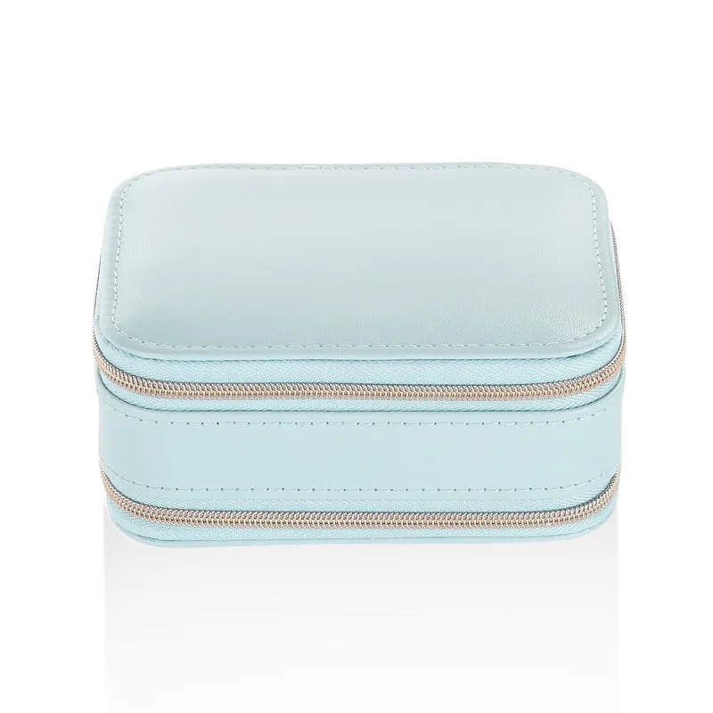 Small PU zipper jewellery box in light blue with fabric lining, 11.5x8.5x5cm, open to show rings and earrings