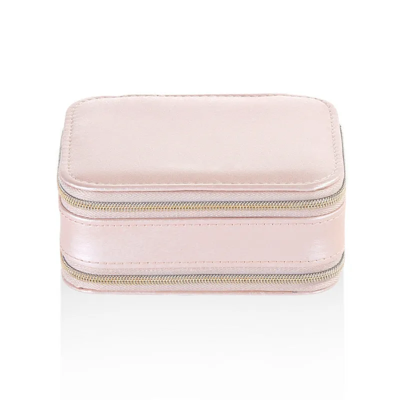 Small PU zipper jewellery box in light blue with fabric lining, 11.5x8.5x5cm, open to show rings and earrings