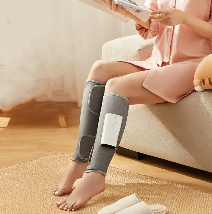 Rechargeable calf air wave leg massager with wireless remote control on a sofa