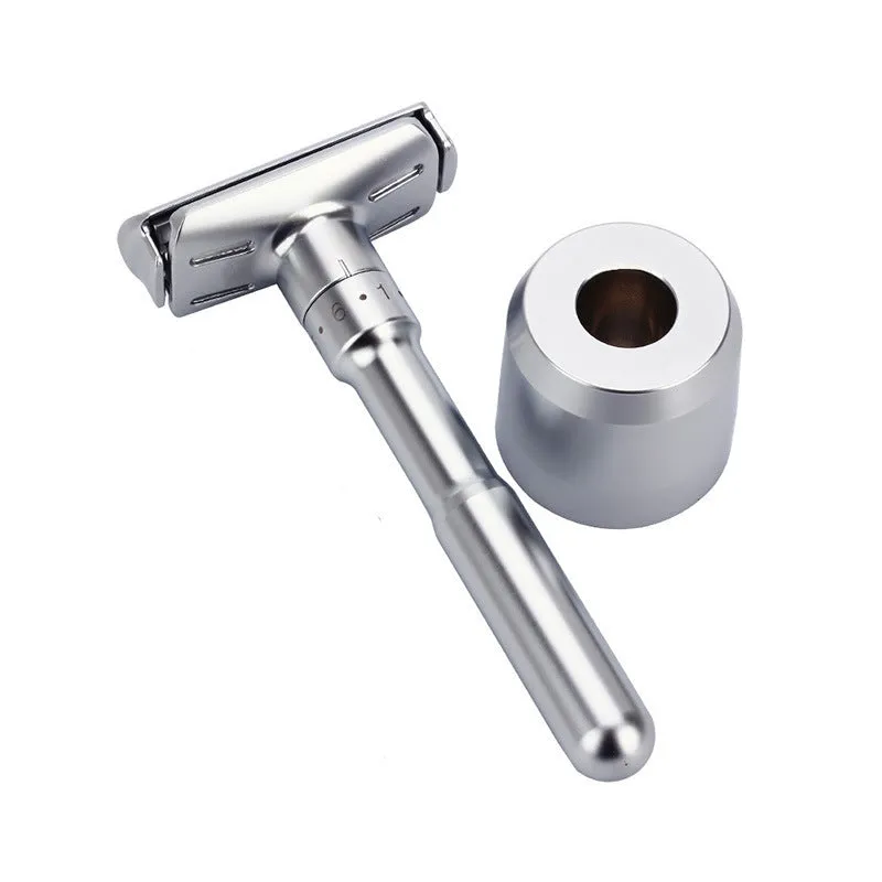 Manual old-fashioned razor with stainless steel blade and zinc alloy handle in black finish on a neutral background