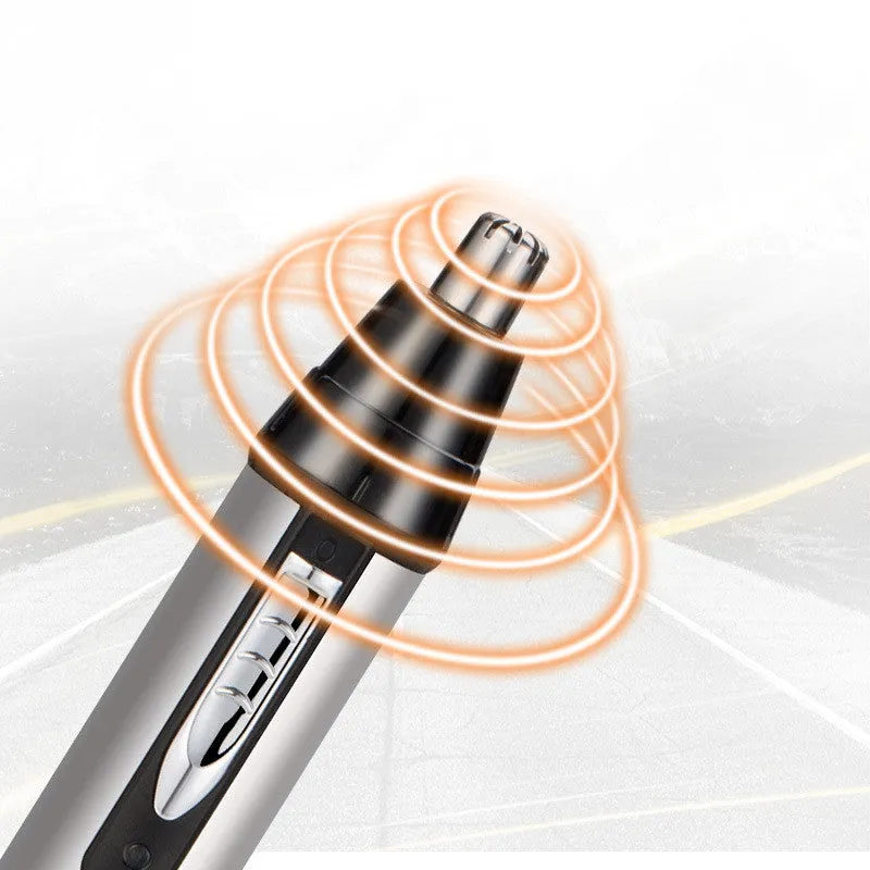 White male electric nose hair trimmer with charging base and four heads on a table