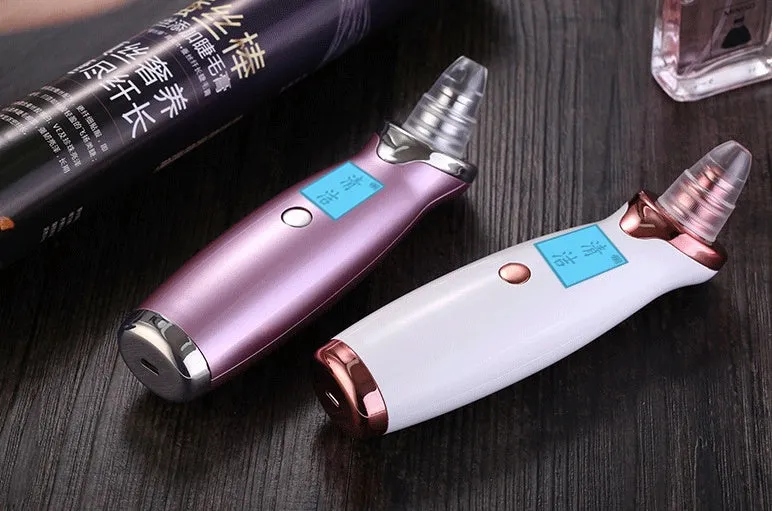 Blackhead remover pore cleaner with LCD display in ivory white on a clean surface