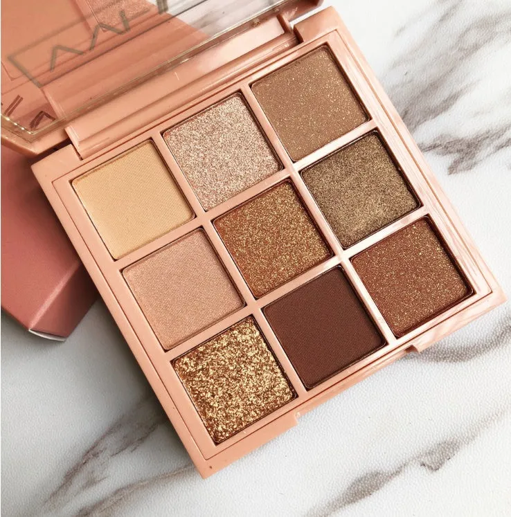 Nine-colour eyeshadow palette with warm brown, charred orange, and nude matte and pearlescent shades